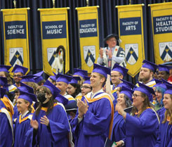 BU graduates clapping during convocation ceremony