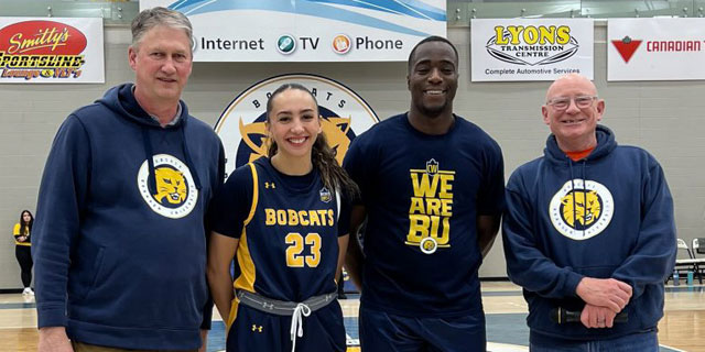 BU Athletics Director Russ Paddock and BU President David Docherty with members of the BU Bobcats, Faith Clearsky and Silas Owusu-Acheaw
